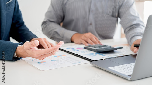 Administrator business man financial inspector and secretary making report calculating balance. Internal Revenue Service checking document. Audit concept