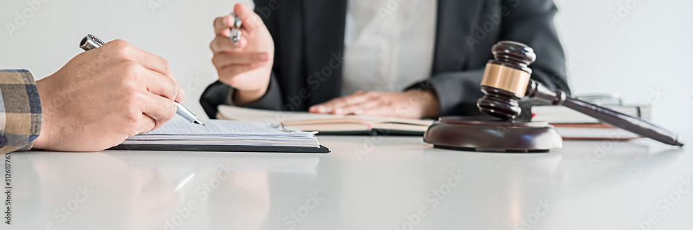 Judge gavel with Justice lawyers having team meeting at law firm background. Concepts of Law and Legal services. Judge gavel with Justice lawyers having team meeting at law firm background. Concepts of Law and Legal services.