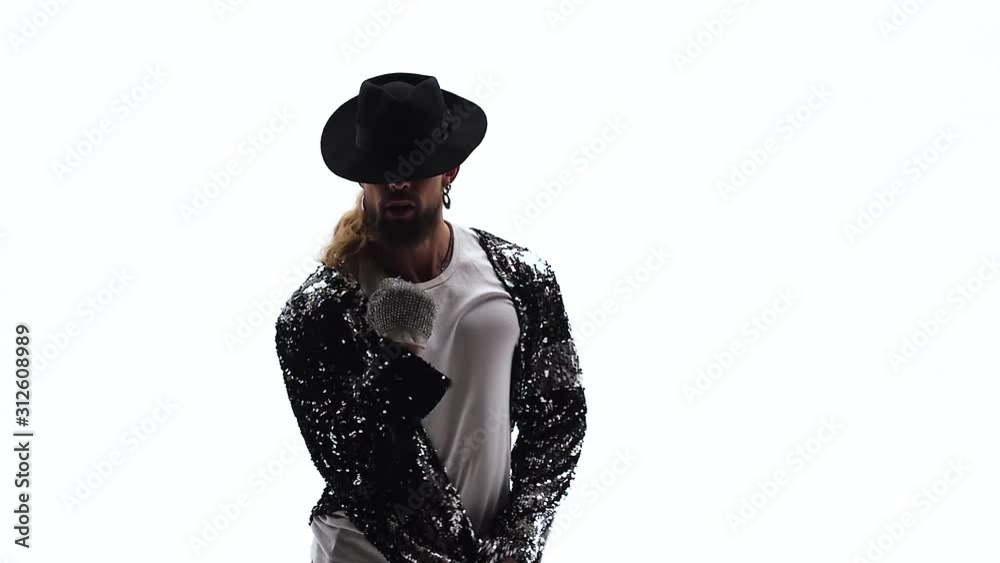 Young stylish teenager is showing dance moves. Isolated over white background. Close up, slow motion. Young stylish teenager is showing dance moves. Isolated over white background. Close up, slow motion.