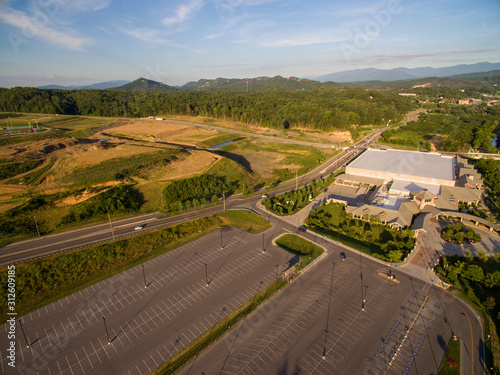 A drone, birds eye, aerial view of some local construction in the tourist town of Pigeon Forge, Tennessee