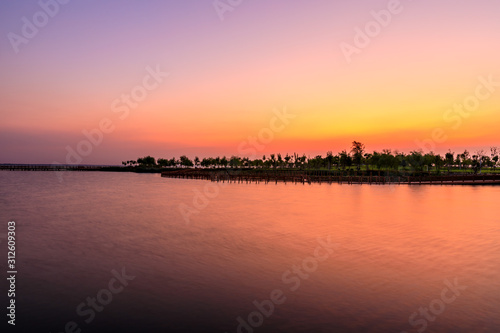 Dreamy sunset landscape by the lake