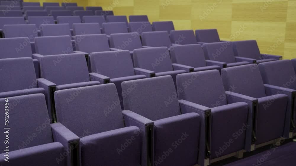 Modern auditorium or lecture hall with empty seats Modern auditorium or lecture hall with empty seats