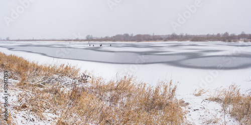 Oka River with fishermen on ice