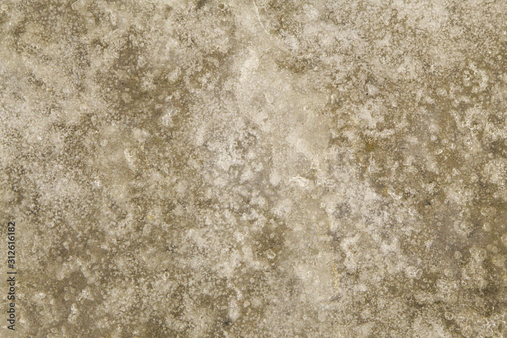Unusual ice patterns on the surface of the puddle Unusual ice patterns on the surface of the puddle