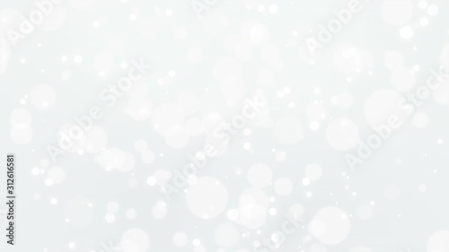 Glowing silver white bokeh background with moving light particles.
