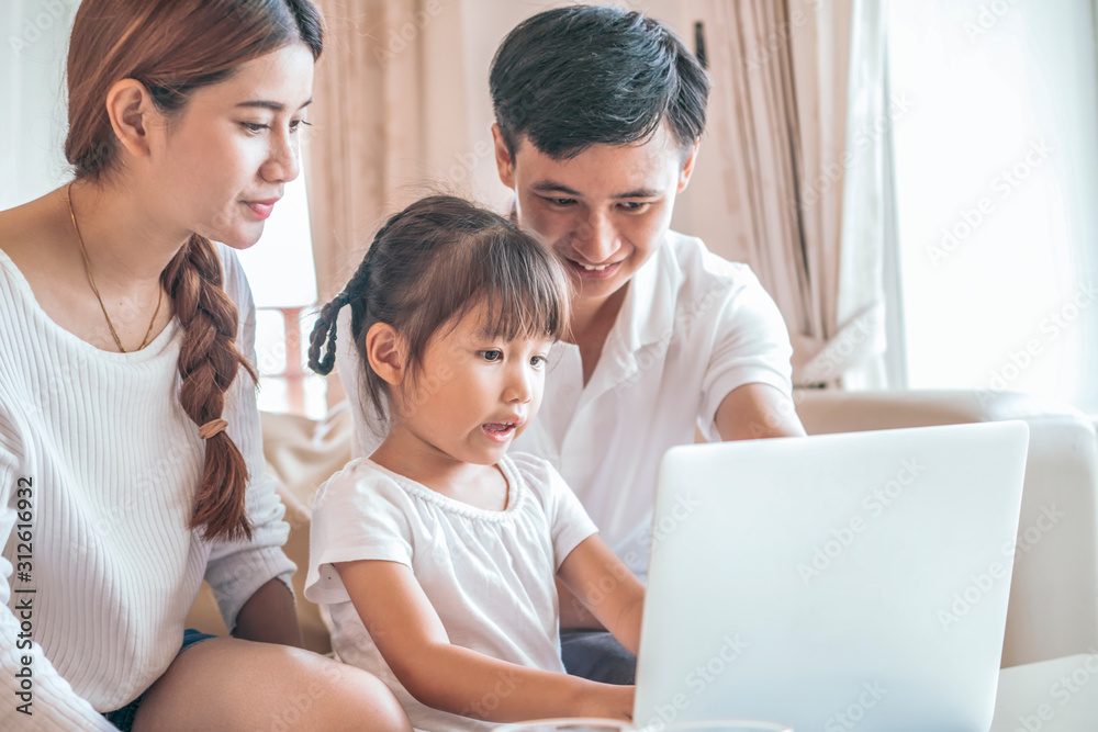 happy family surfing internet together at lovely home happy family surfing internet together at lovely home