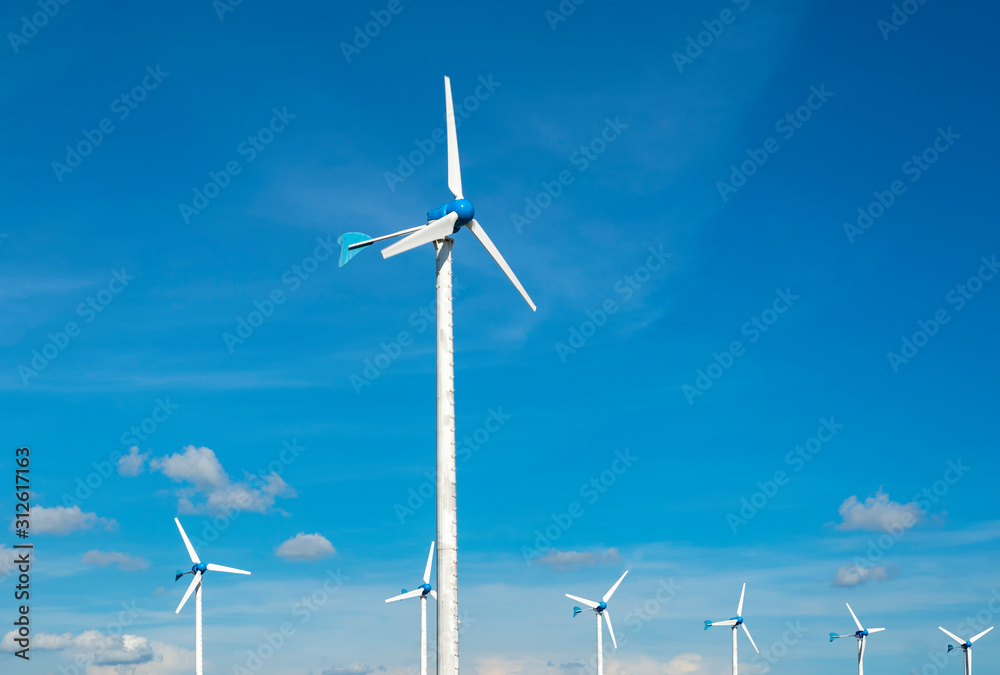 Wind turbine for electric power production a eco power for future with blue sky background Wind turbine for electric power production a eco power for future with blue sky background
