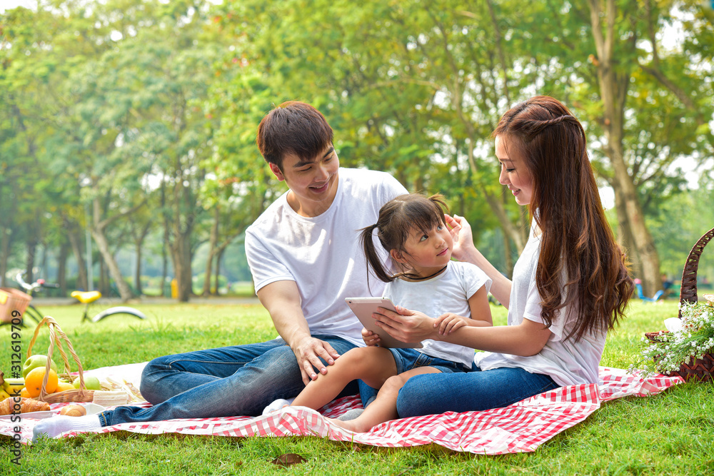 portrait of happy Asian family with picnic meal in relaxing day in garden, Asian family concept portrait of happy Asian family with picnic meal in relaxing day in garden, Asian family concept
