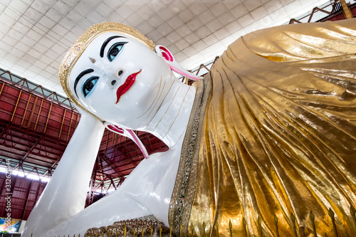 Beautiful Reclining Buddha Chauk htat gyi. Buddha Temple in Yangon, Myanmar, photo