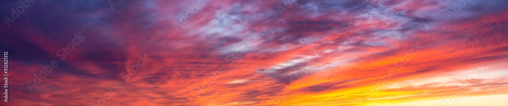 Dramatic Panoramic View of a cloudscape during a dark and colorful sunset. Taken in British Columbia, Canada.