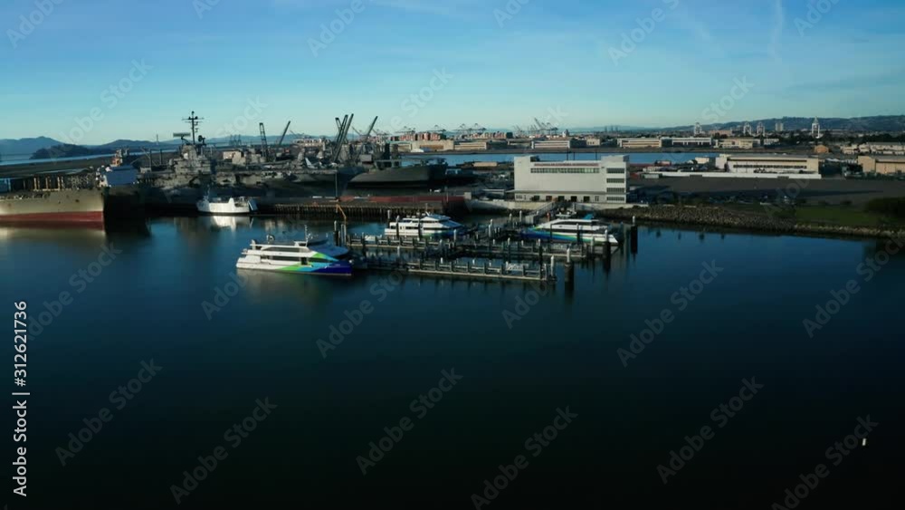 Massive industrial ships in the berths near the estuary and marina. Massive industrial ships in the berths near the estuary and marina.