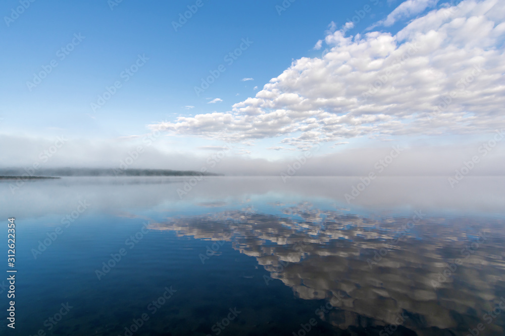 Clouds and fog at dawn. Pskov region. Russia