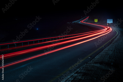 highway long exposure vehicle light trails curvy highway between mountains eilat israel	
