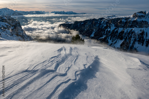 snow drift in the swiss alps in front of Mount Stockhorn and Justistal