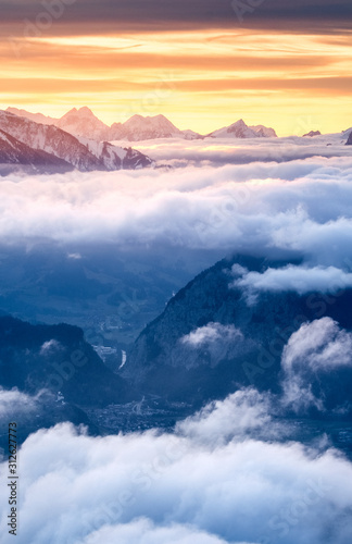 sea of fog in front of the Swiss Alps at a winter sunset