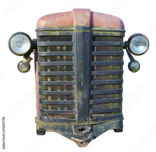 Rusty front grille of a vintage farmer no name tractor of production of the beginning of the twentieth century isolated