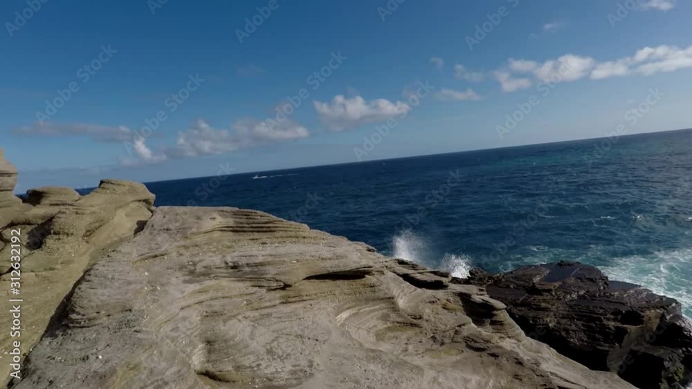 Blue ocean taken from the top of a cliff panning from right to left Blue ocean taken from the top of a cliff panning from right to left