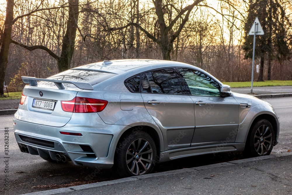 Very aggressive looking BMW X6 E71 modified by Lumma Design as CLR X 650 M.  Extreme tuning can be sometimes denoted as tuzing as well Stock Photo |  Adobe Stock