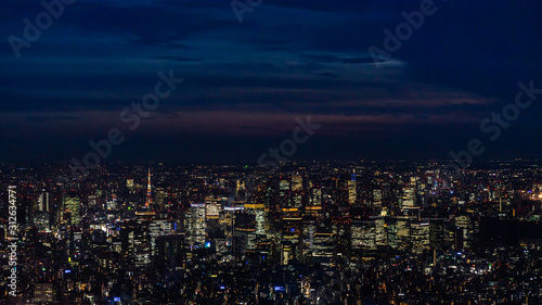Panoramic view of Tokyo from Skytree tv tower observation deck with skyscrapers illuminated at night  Japan