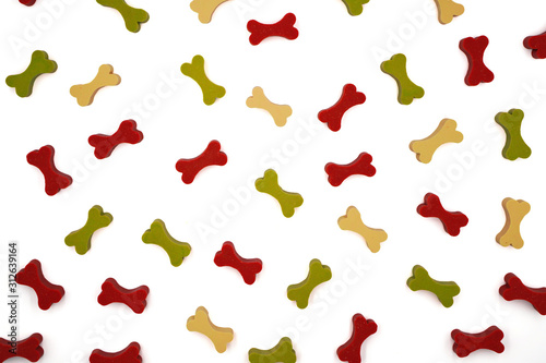 top view of pattern of colorful dog treat or snack in bone shape ,for dog lover background , on white background