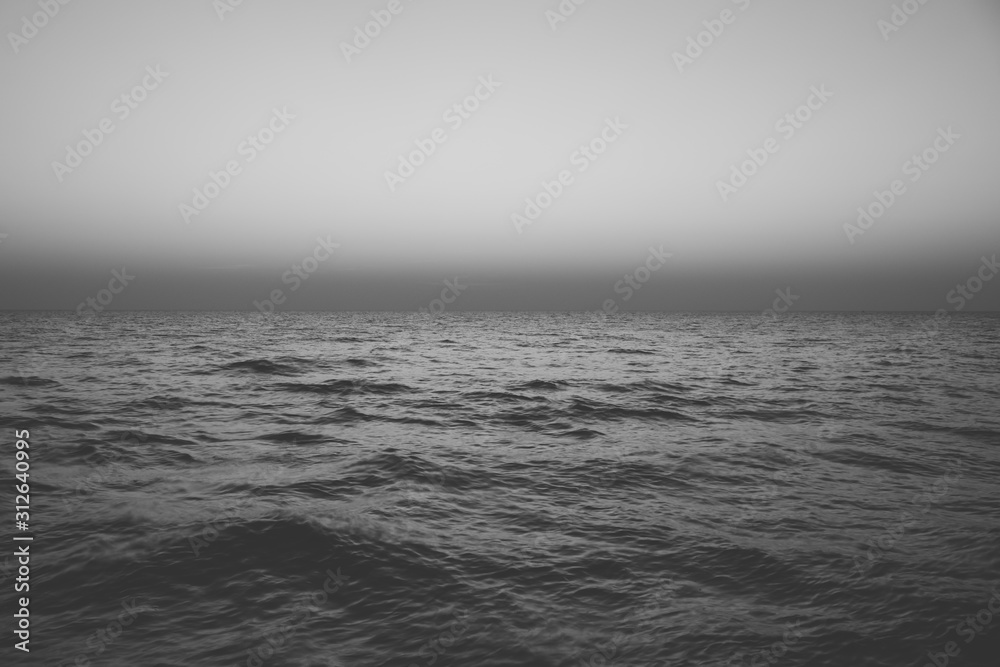 Abstract Black and White image of Seascape view of sea wave in twilight time. (Selective focus) Abstract Black and White image of Seascape view of sea wave in twilight time. (Selective focus)