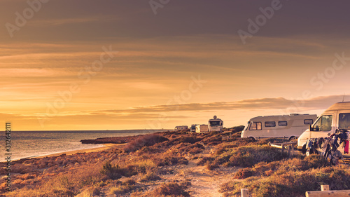 Camper cars on beach sea shore
