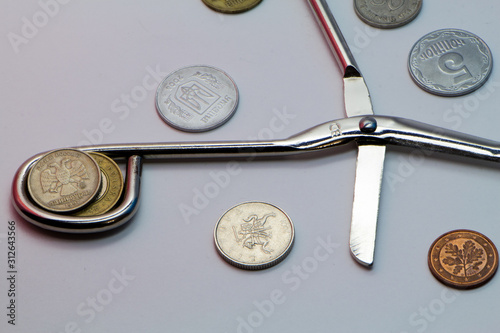 coins and watch on white background