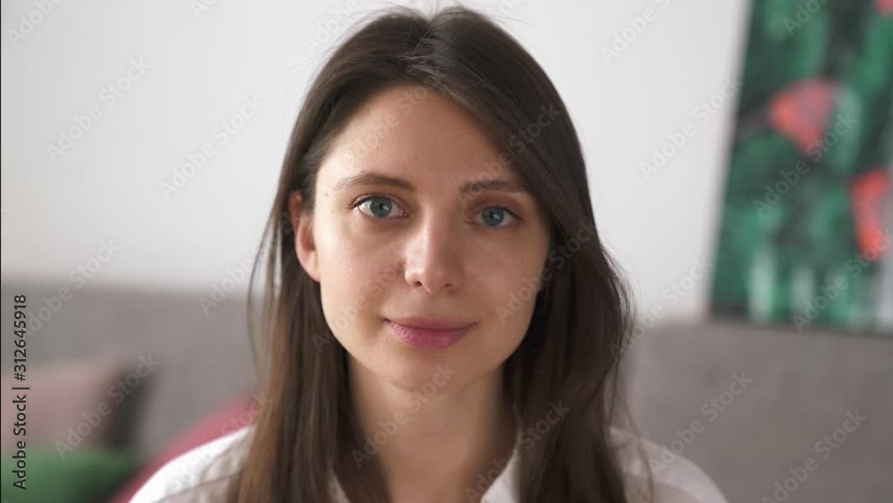 Close up portrait of attractive young woman smiling brunette confident pretty into Camera Close up portrait of attractive young woman smiling brunette confident pretty into Camera