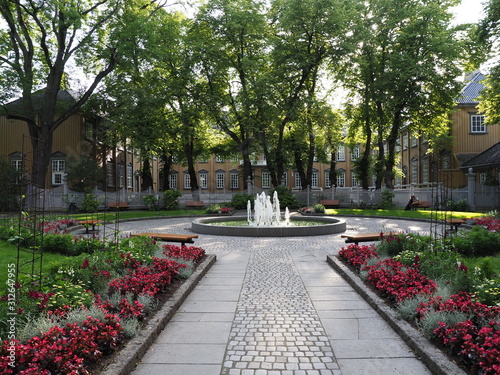 Fountain at park in front of Stiftsgarden in Trondheim city, Norway photo