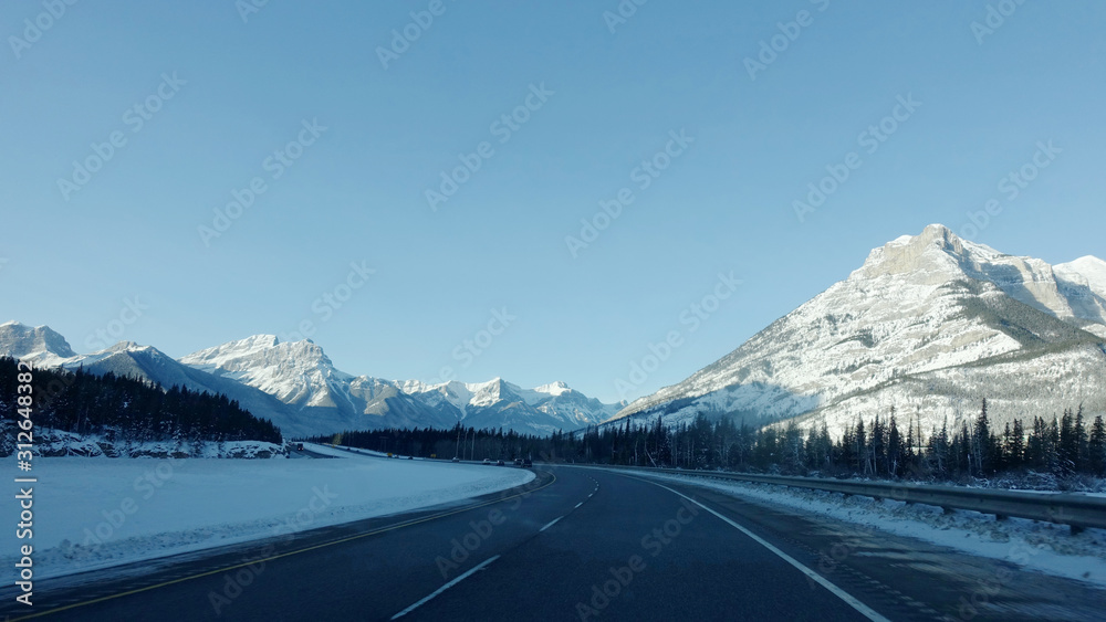 Trans-Canada Highway and snow covered mountains in Banff National Park in Alberta, Canada