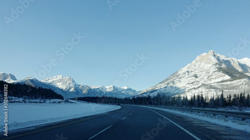 Trans-Canada Highway and snow covered mountains in Banff National Park in Alberta, Canada