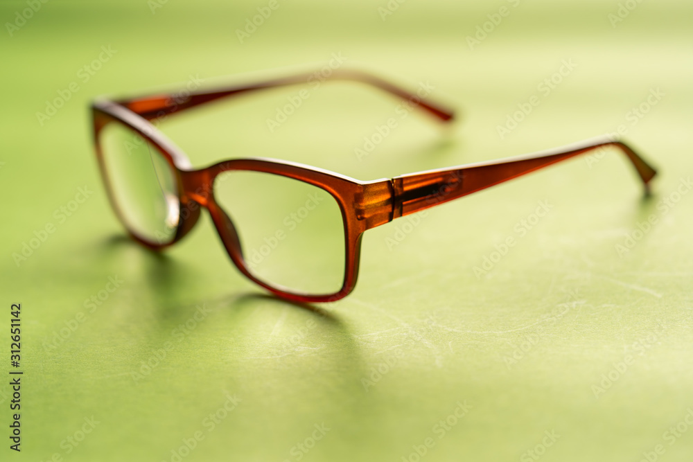 Spectacle or eye glass isolated against green Spectacle or eye glass isolated against green