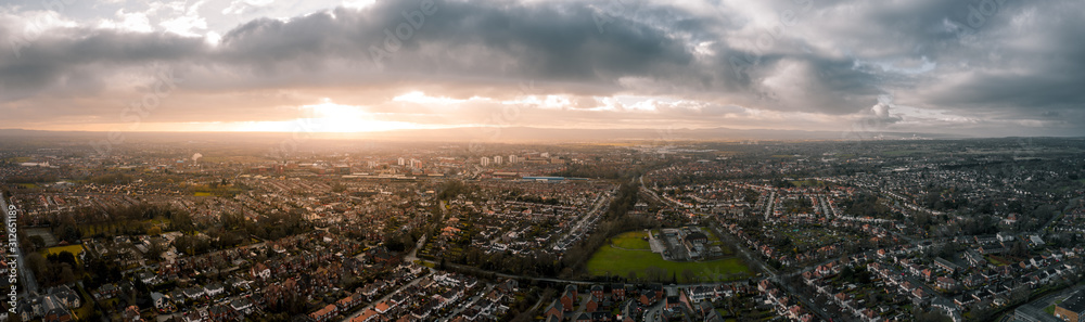 Beautiful Aerial Panorama of Chester at sunset in, Cheshire, UK. Christmas Day December 2019, showing residential buildings and a cloudy sky