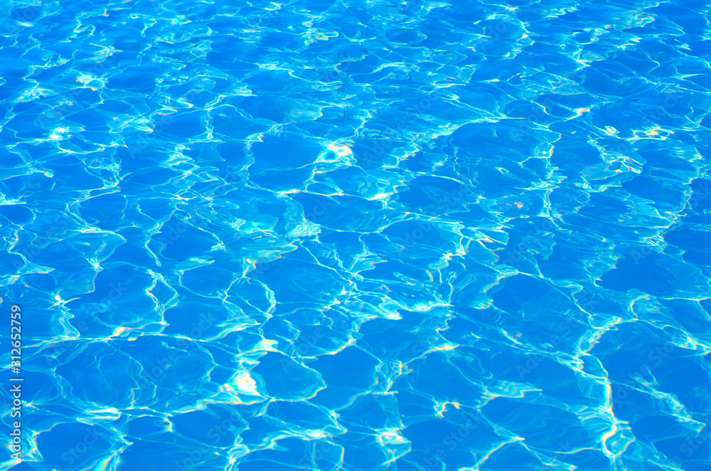 surface of blue swimming pool,background of water in swimming pool.
