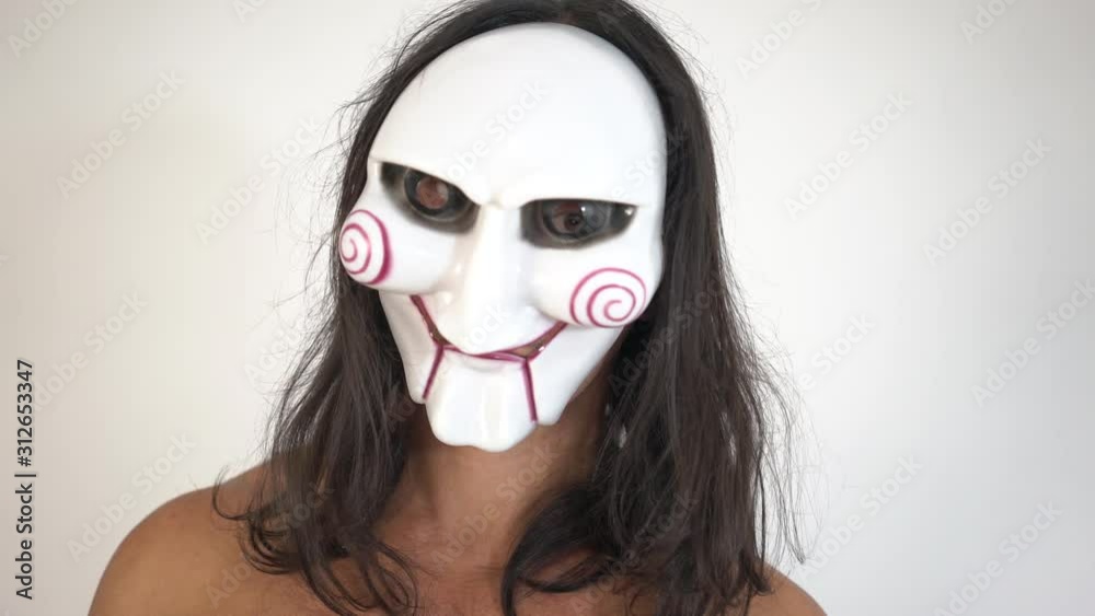A man in a terrible silver skull mask, close-up, a white background A man in a terrible silver skull mask, close-up, a white background