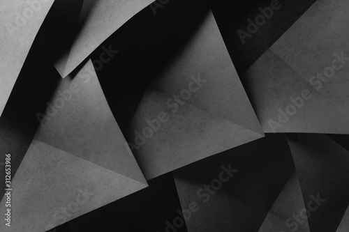 Geometric shapes made paper, dark background.