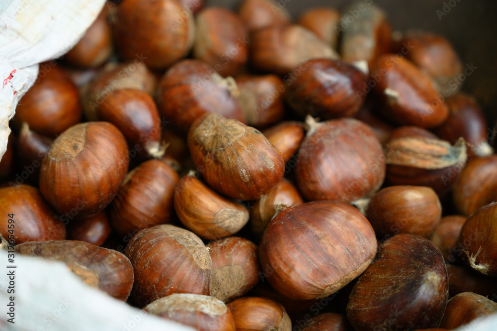 New harvest of chesnuts on market New harvest of chesnuts on market