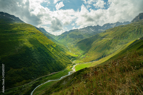The Furka Pass  is a high mountain pass in the Swiss Alps connecting Gletsch, Valais with Realp, Uri. The Furka Oberalp Bahn line through the Furka Tunnel