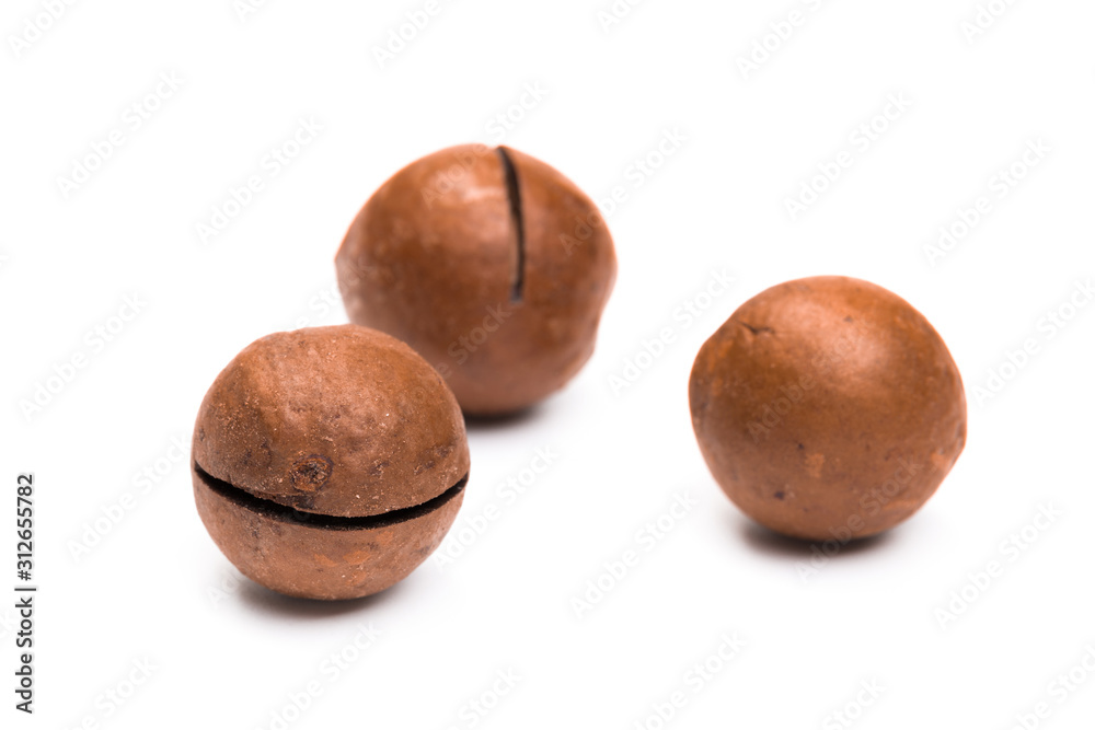Shelled macadamia nuts on white background Shelled macadamia nuts on white background