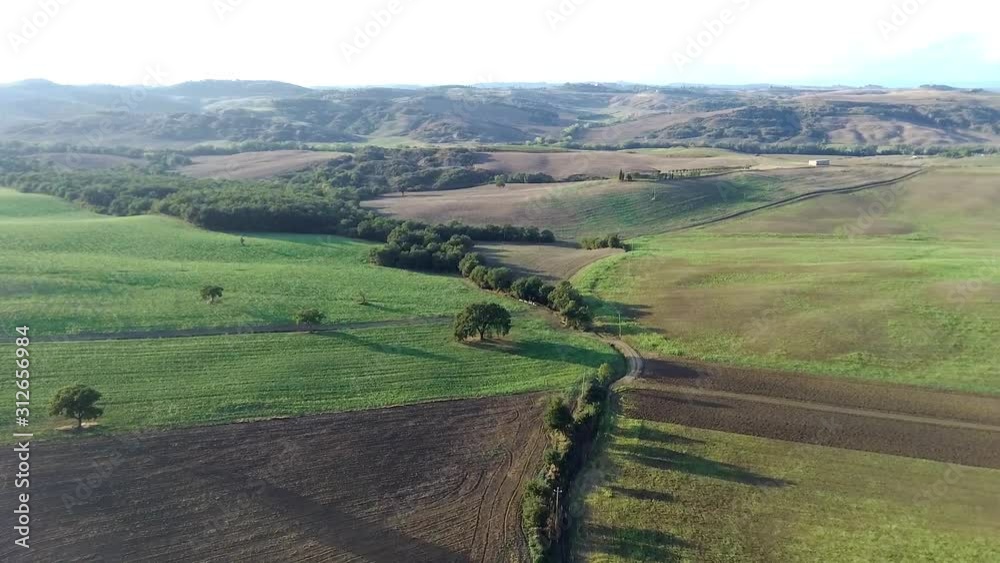 Aerial flyover the beautiful sunset landscape in Tuscany, Italy. Aerial flyover the beautiful sunset landscape in Tuscany, Italy.