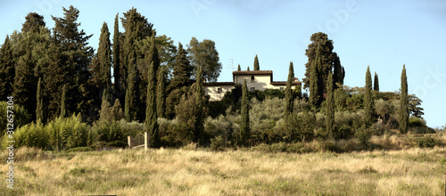 Tuscan Villa upon hilltop surrounded with cypresses