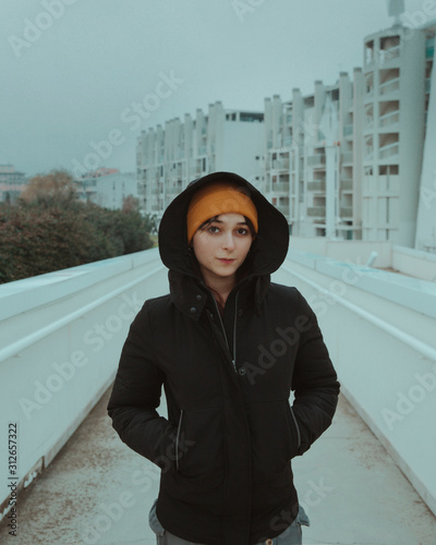 Woman with jacket and hat in cold winter day 