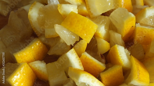  macro image of finely chopped yellow juicy lemon