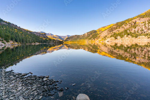 Reflection of aspen trees on Lake San Cristobal in the San Juan Mountains of ...
