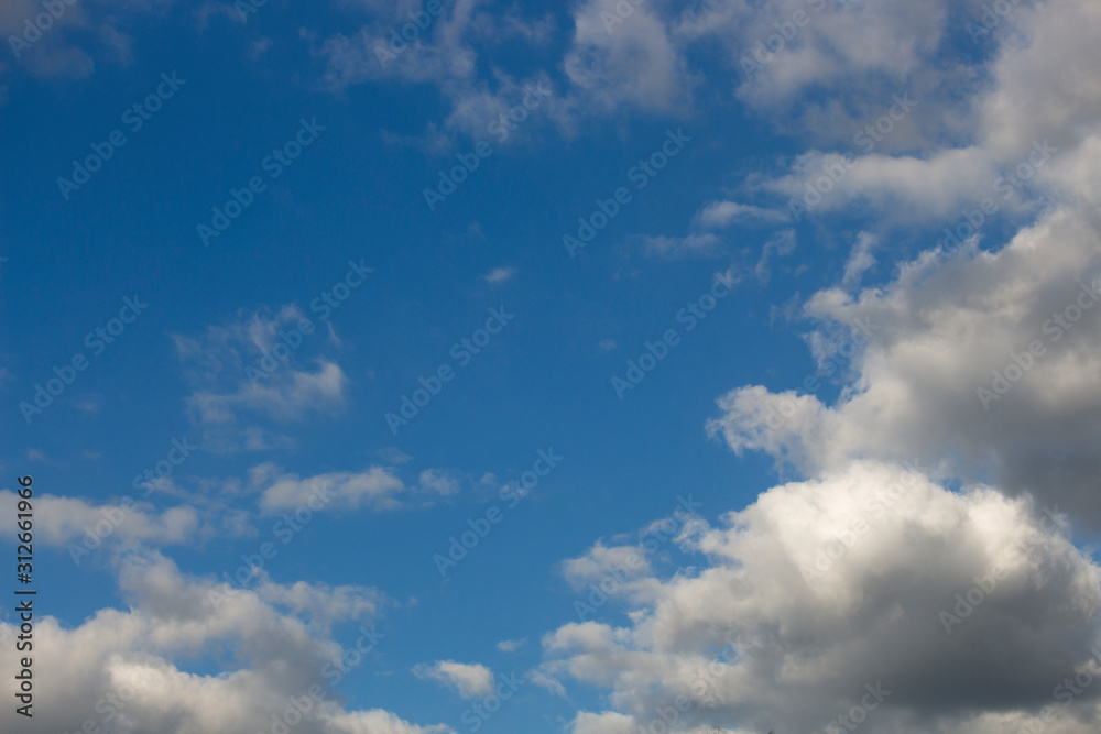 Fototapeta premium Bright blue sky with white clouds for background or wallpapers