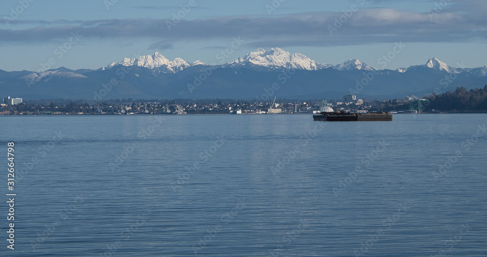 2019-12-29 THE MUKLITO SHORELINE WITH SNOW CAPPED MOUNTAINS