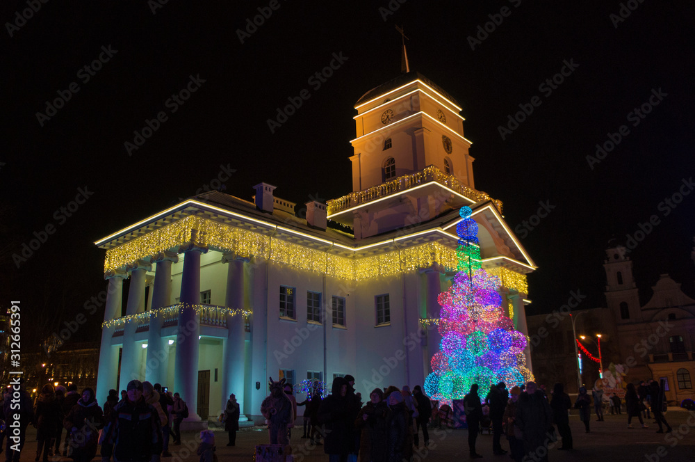 Naklejka premium Christmas neon city hall. New Year's luminous building. Minsk Belarus. December 31 2019