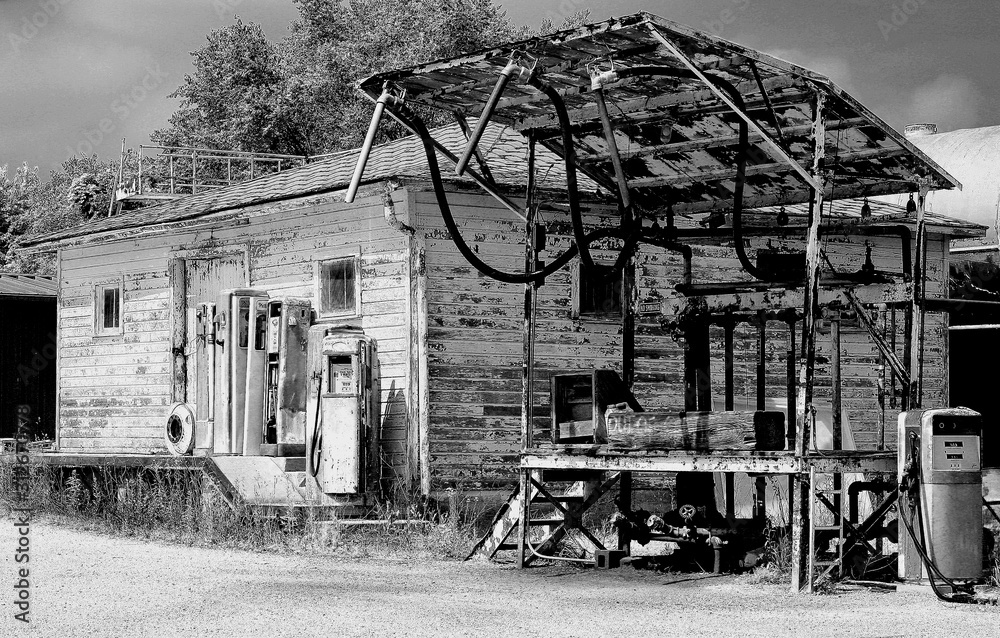Fototapeta premium old abandoned gas station rural house rustic black and white