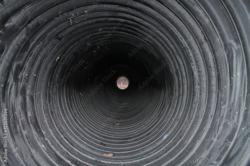 Black pipe for draining water. Passage through the pipe Black pipe for draining water. Passage through the pipe