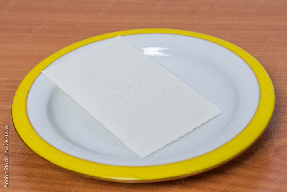 Traditional East European Christmas eve wafer on plate. Traditional East European Christmas eve wafer on plate.